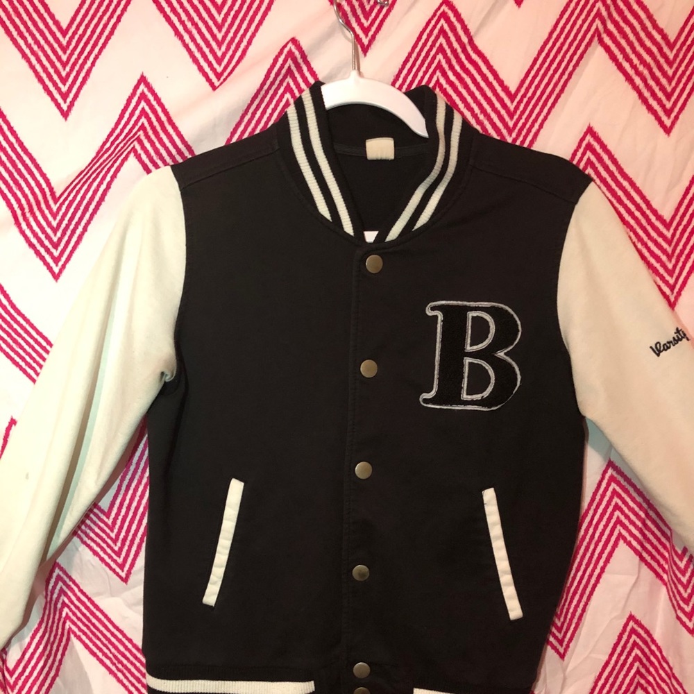 Black and white varsity B. jacket